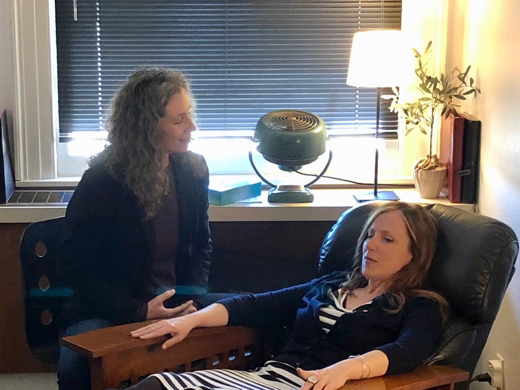 Board certified hypnotist Erika Flint working with a hypnosis client