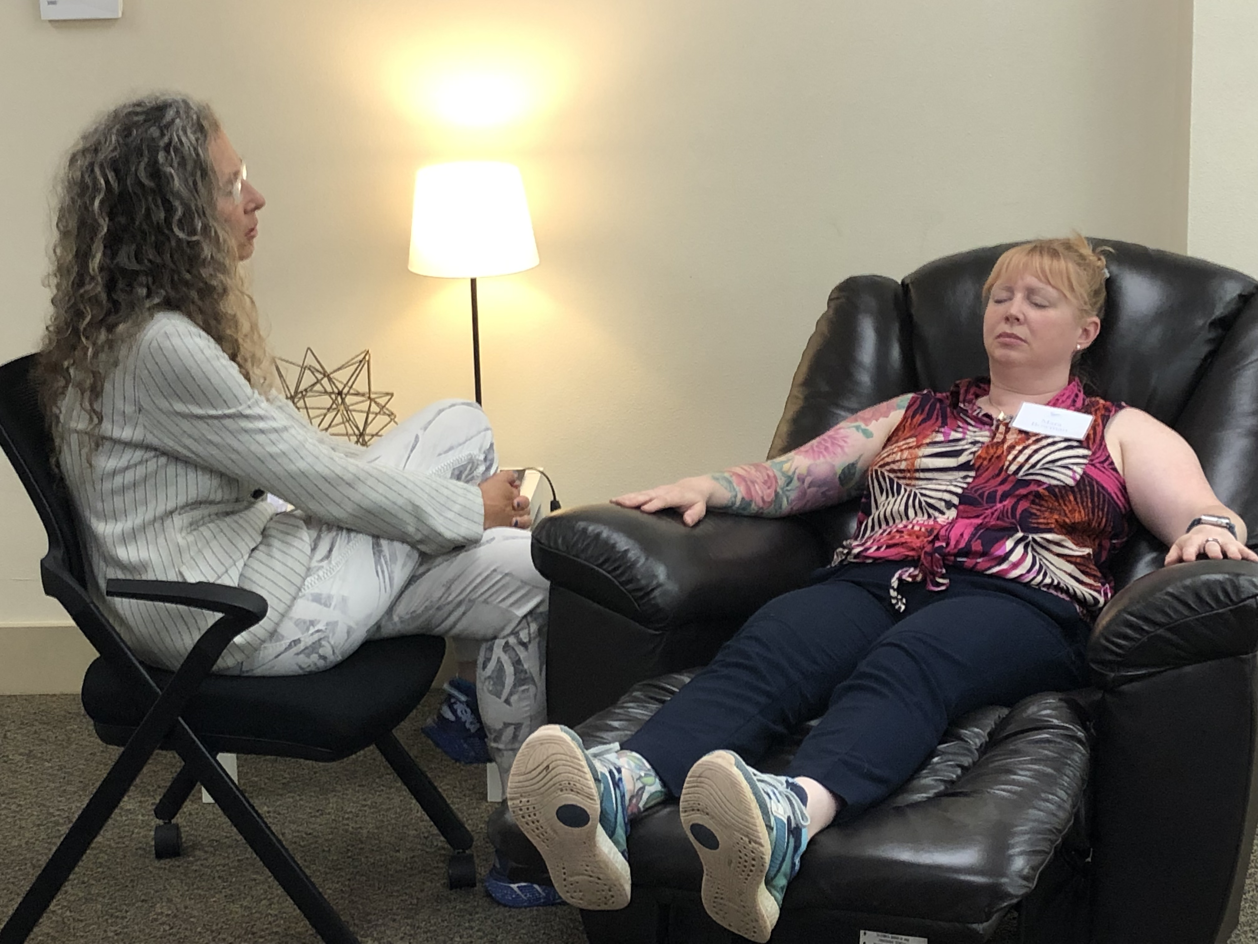 Erika Flint teaching hypnosis with a student